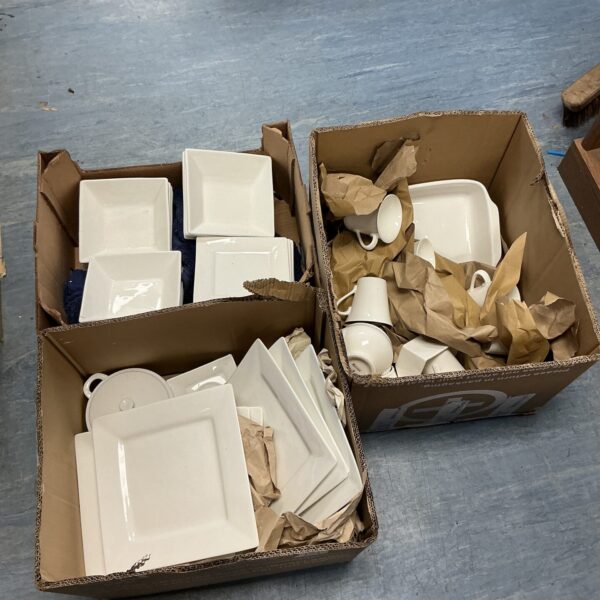 White Maxwell Williams dinnerware set in cardboard boxes.