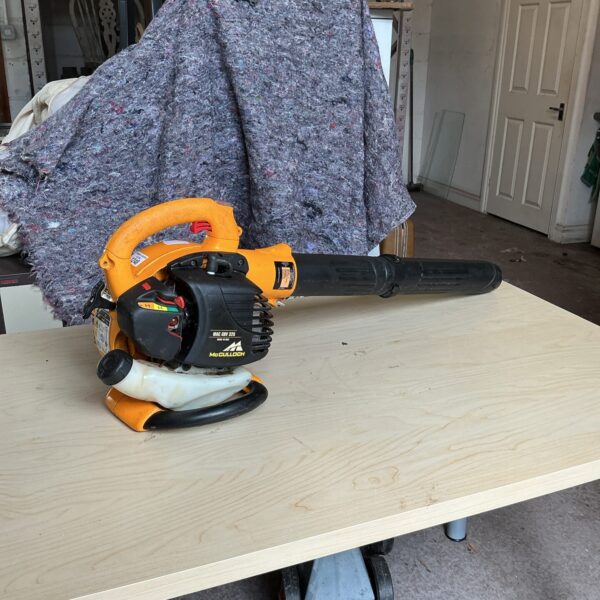 Used McCulloch 325 petrol leaf blower for garden clearing.