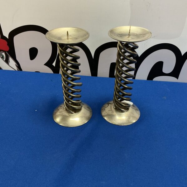 Vintage metal coil candle holders for table decor.