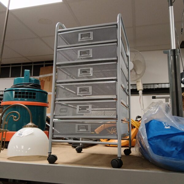 Six-drawer metal craft drawers on casters for workshop storage.