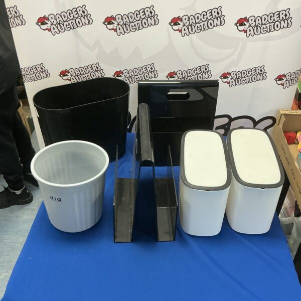 Silver metal waste bin, simple cylindrical design.