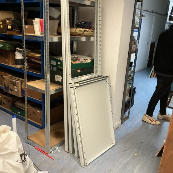 Used metal workshop shelving unit for storage and organisation.