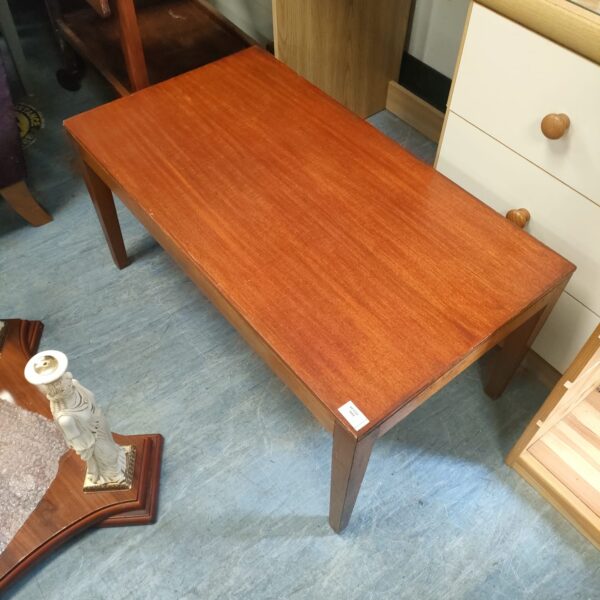 Vintage mid-century coffee table with teak veneer and military markings.