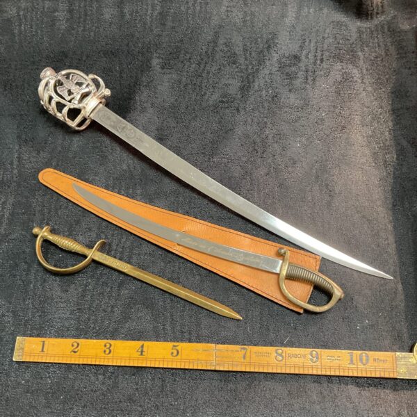Antique miniature sword collection with German example.