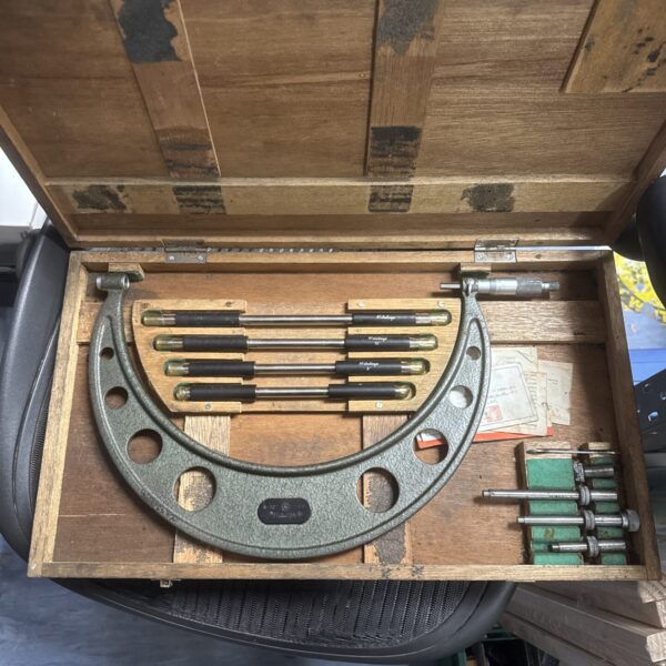 Vintage Mitutoyo micrometer for precision measurement, a classic machinist tool.