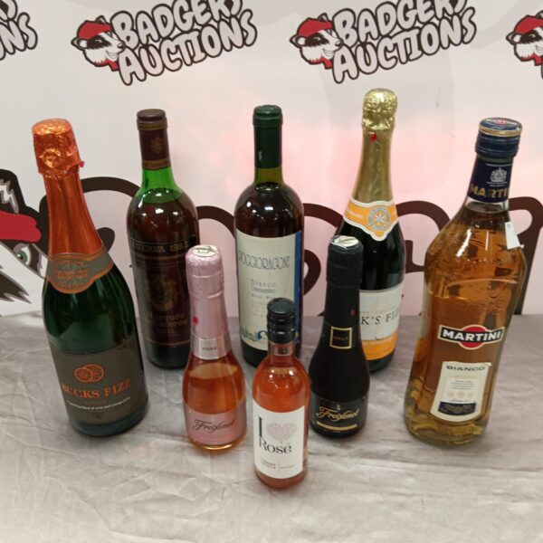 Mixed alcohol lot including Bucks Fizz and Martini bottles.