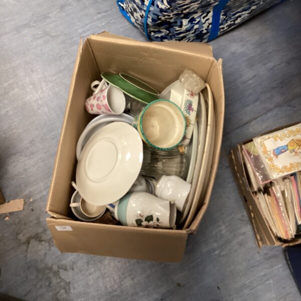 Mixed china and dish lot with teacups and bowls.