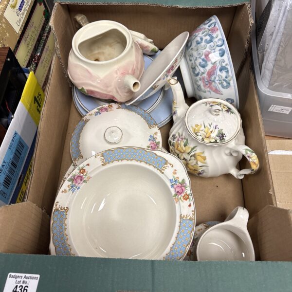 Vintage mixed chinaware lot with floral teapot and serving dishes.