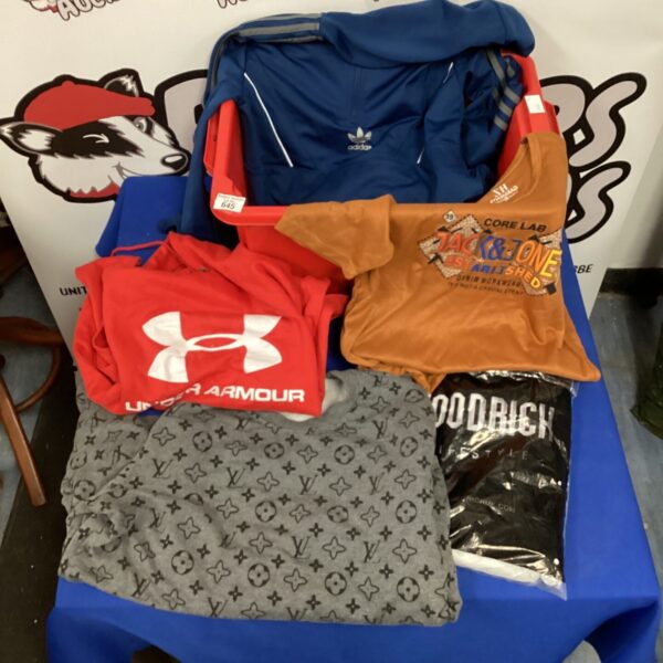 Mixed clothing lot featuring Adidas and Puma sportswear.