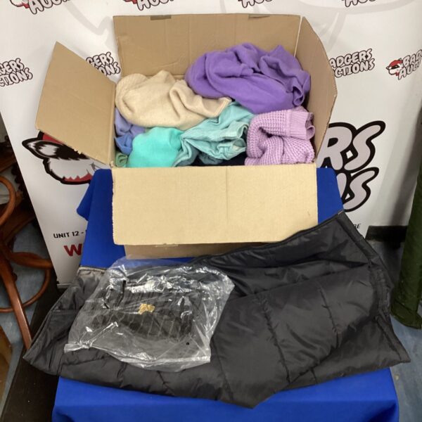 Mixed clothing lot with colourful jumpers and knitwear.