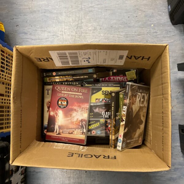 Mixed DVD lot with various film titles visible.