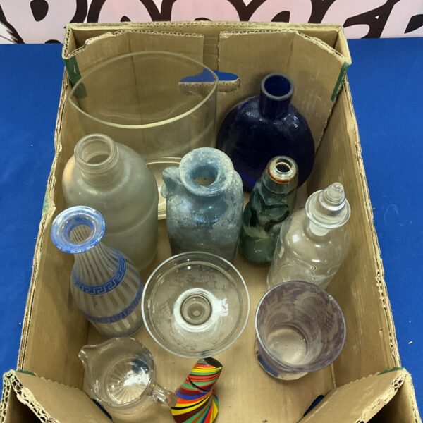 Mixed glassware lot featuring vintage bottles and glasses.