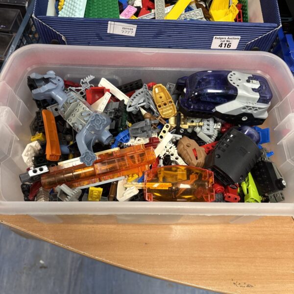 Assorted mixed Lego bricks and pieces in a storage box.
