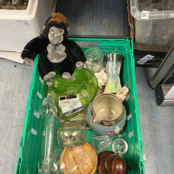 Mixed lot of vintage crystal and glassware on display.