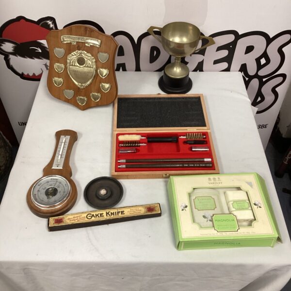 Mixed lot of vintage trophies, a Yardley gift set, and cleaning kit.