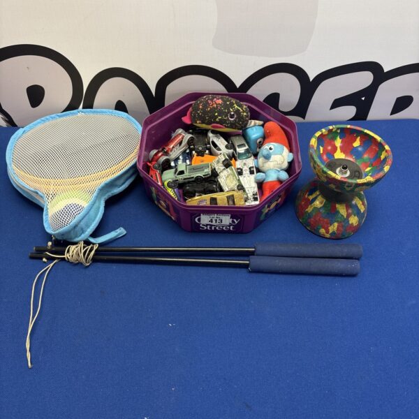 Mixed toy lot featuring diecast models and colourful plastic toys.