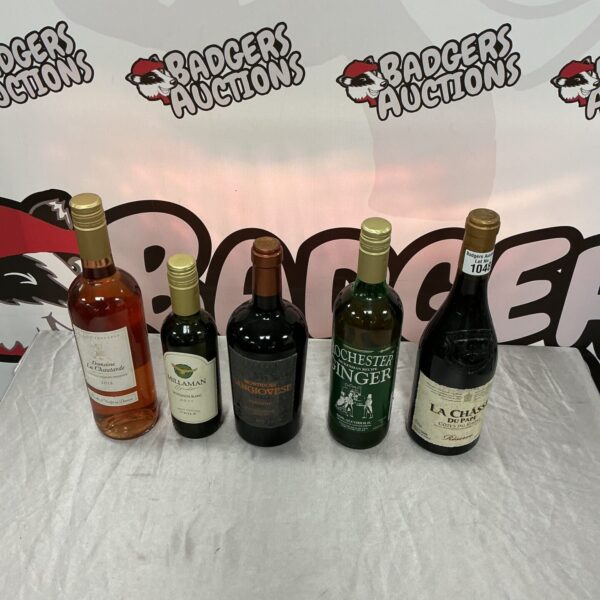 Mixed wine lot with five bottles of varying colours.