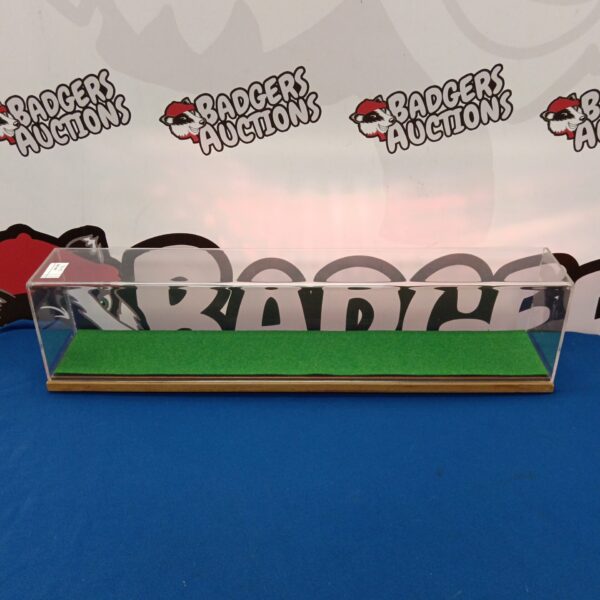 Clear Perspex model train display case measuring 52x15x10cm.