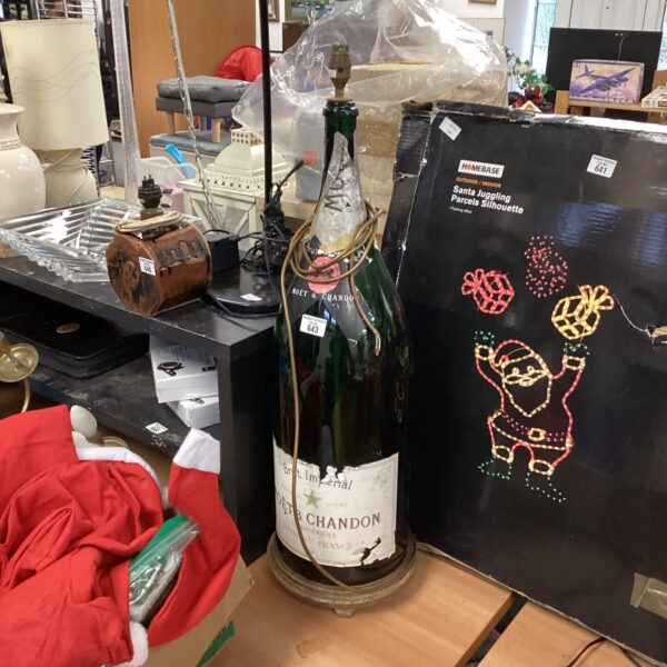 Large Moet & Chandon champagne bottle repurposed as a stylish standard lamp.