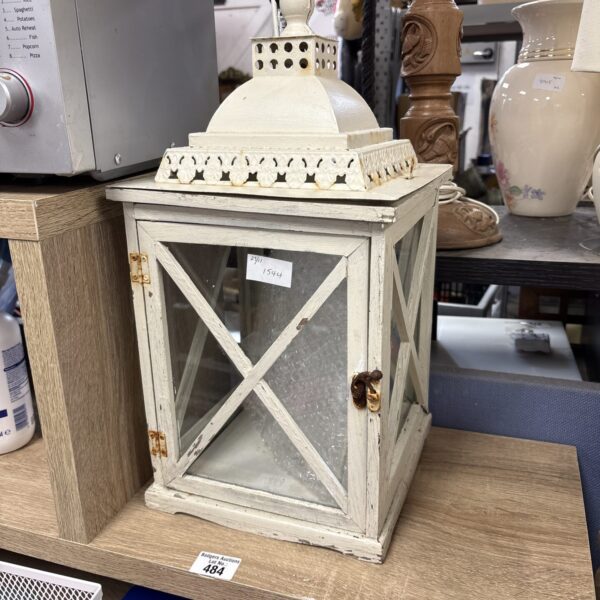 Intricate pierced metal Moroccan candle lantern, vintage style.