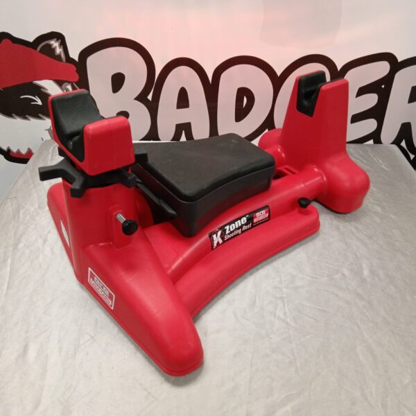 Red MTM K-Zone shooting rest for stable firearm support.