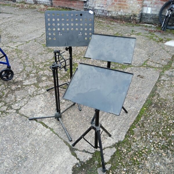 Lot of four adjustable music and microphone stands.