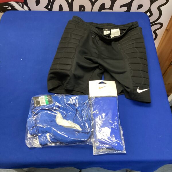 Nike football clothing lot with shorts, socks, and goalkeeper shorts.
