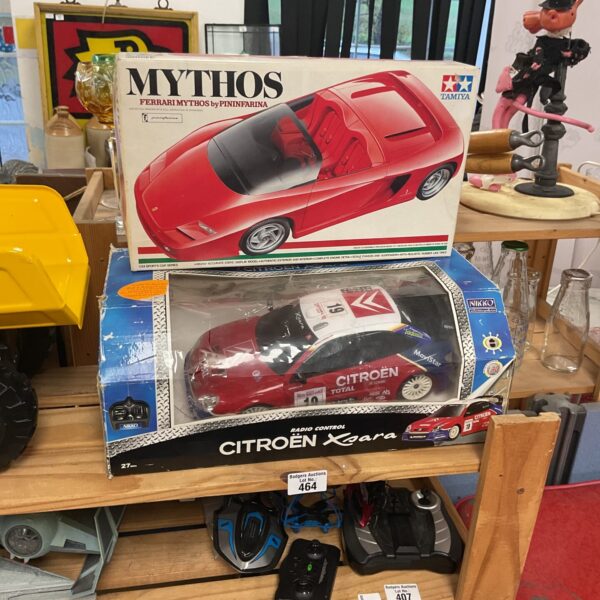 Nikko Citroën Xsara RC car and Tamiya Ferrari Mythos model kit in boxes.