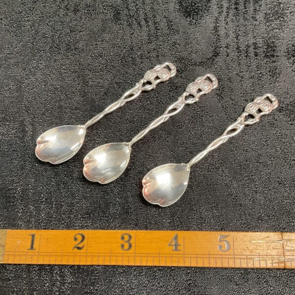 Vintage Nils Johanson Art Nouveau coffee spoons with floral detailing.
