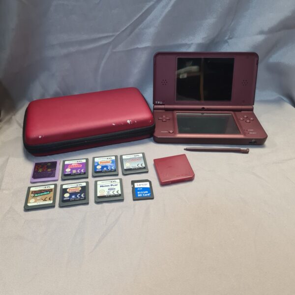 Red Nintendo DS XL console with games and carry case.