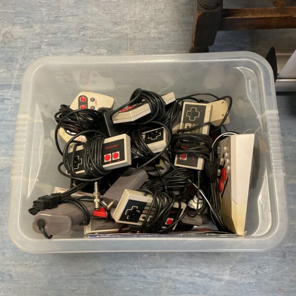 Vintage Nintendo NES & SNES controllers lot for retro gaming.