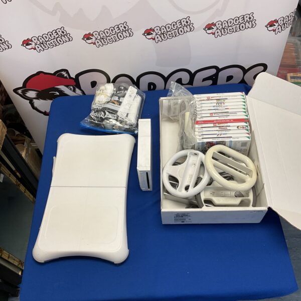 Nintendo Wii console bundle with games and Wii Fit board.