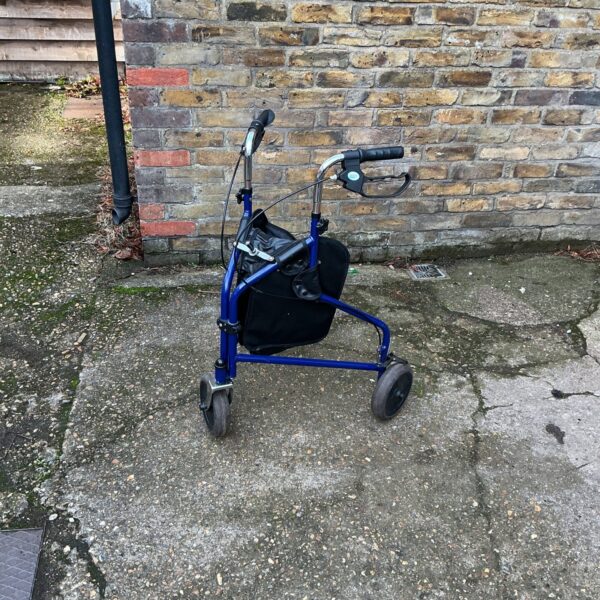 Blue NRS Healthcare walking trolley with basket for mobility support.