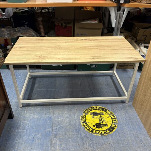 Solid oak coffee table with a black metal frame.