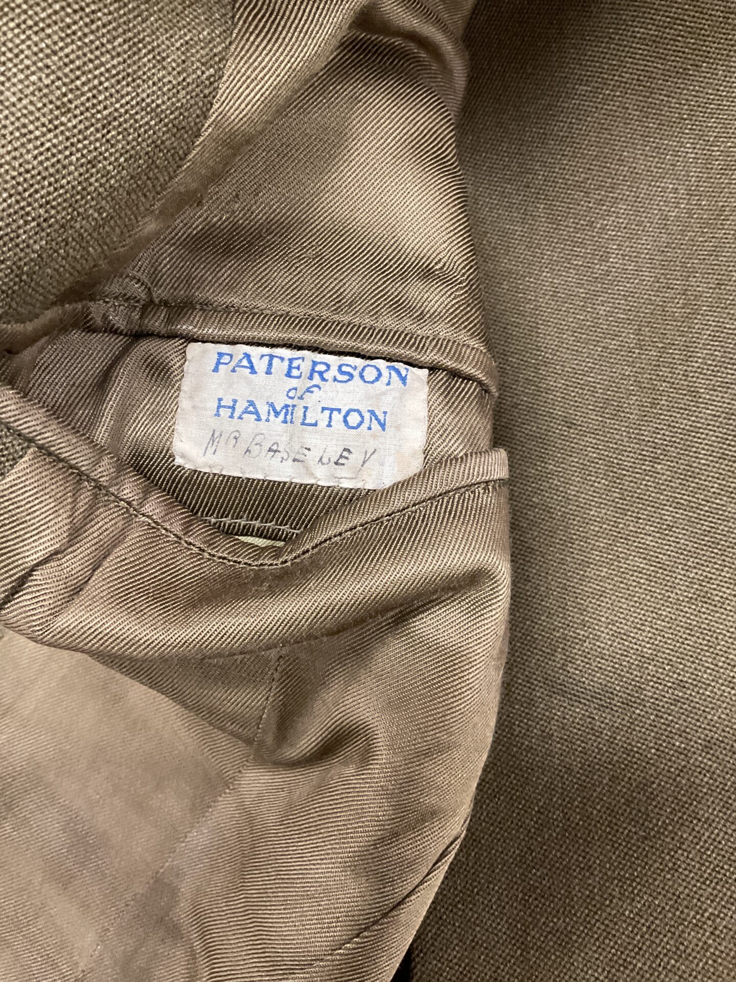 Label inside the officer's jacket, reading "Paterson & Hamilton".