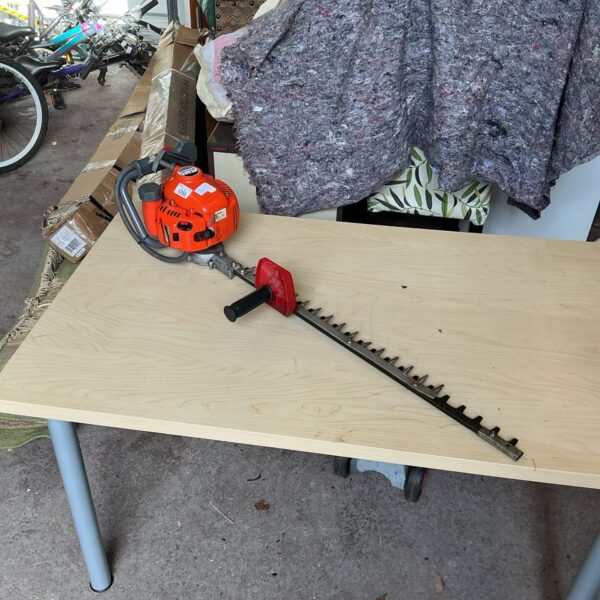 Used Oleo Mac HT26s petrol hedge cutter for garden trimming.