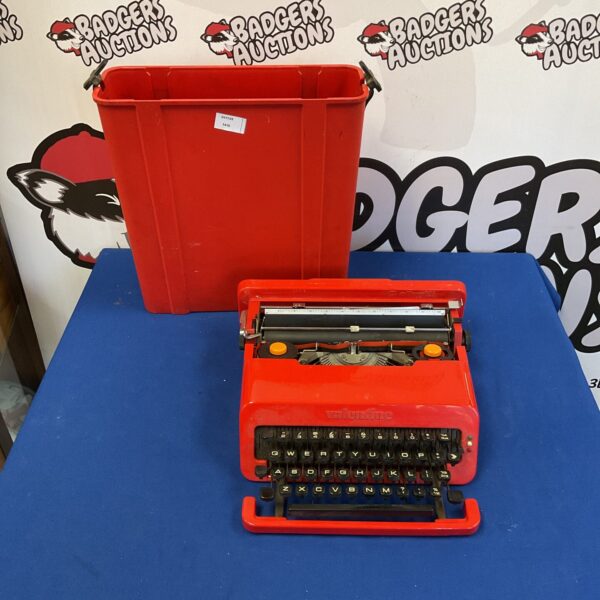 Red Olivetti Valentine typewriter, a vintage portable writing machine.