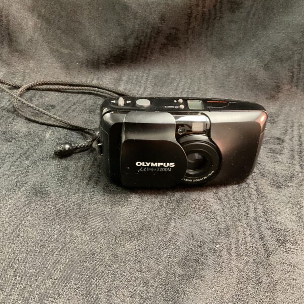 Front view of a vintage Olympus mju 35mm film camera.