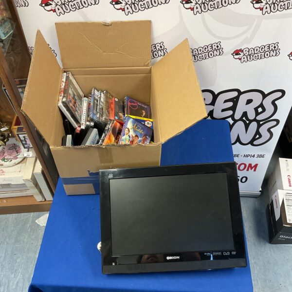 Orion TV DVD combo unit with a box of DVDs.