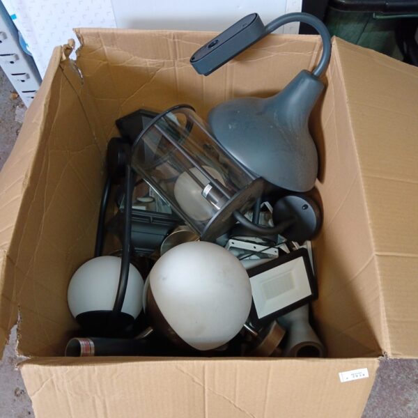 Collection of vintage outdoor lights in a cardboard box.