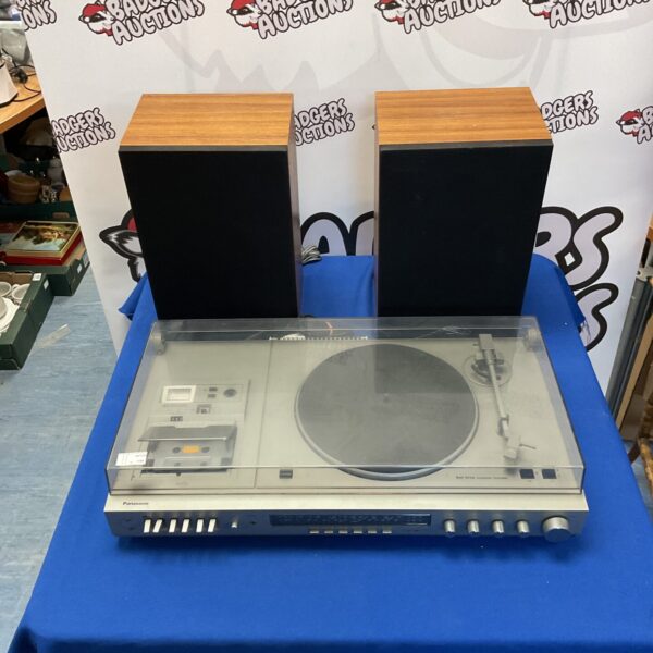 Vintage Panasonic belt drive turntable with two speakers, classic audio equipment.