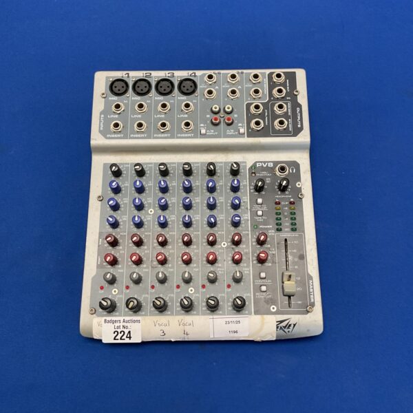 Peavey PV8 mixer console with multiple input channels.