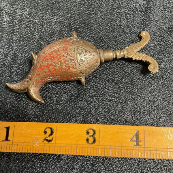 Antique Persian Surma bottle with floral designs, a unique cosmetic container.