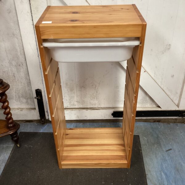 Rustic pine storage unit with a single drawer.