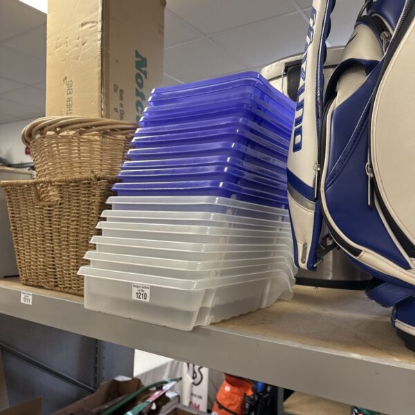 Stack of blue plastic paperwork trays for office organisation.