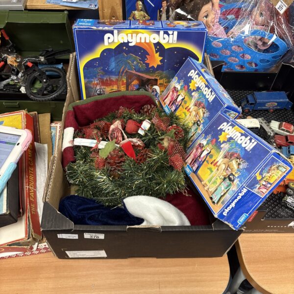 Mixed lot of vintage Playmobile sets and Christmas ornaments for collectors.