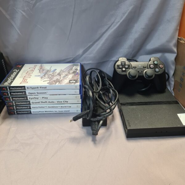 Sony Playstation 2 Slim console with games and controller.