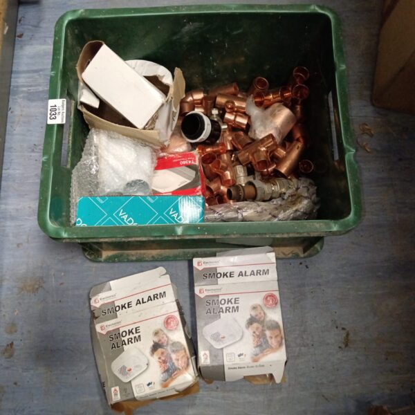 Mixed lot of plumbing fittings and smoke alarms for DIY projects.