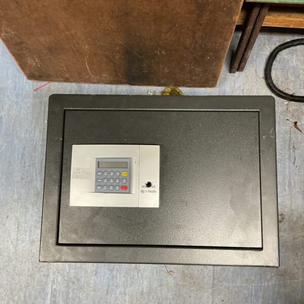 Close-up of a Point safe keypad and locking mechanism.