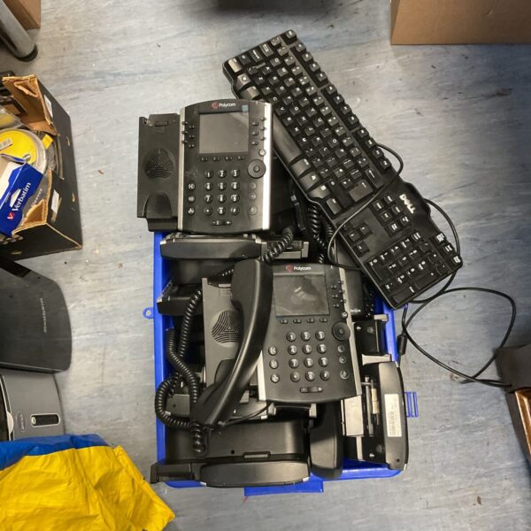 Lot of vintage Polycom office phones and a Dell keyboard.
